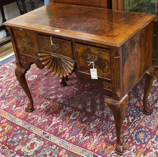 An 18th century style carved walnut lowboy width 91cm